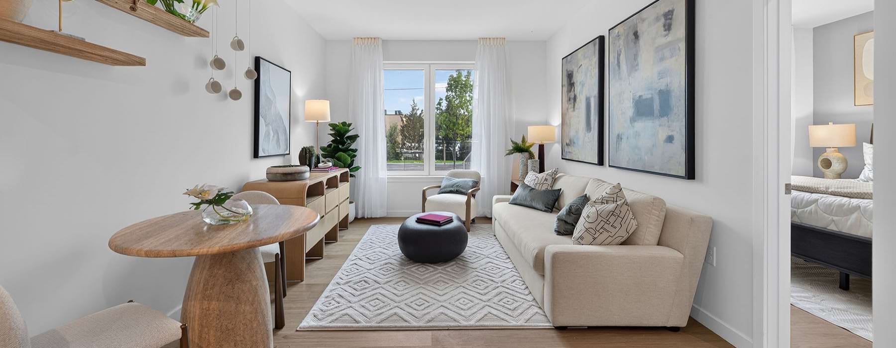 a living room with a couch , tables and a chair