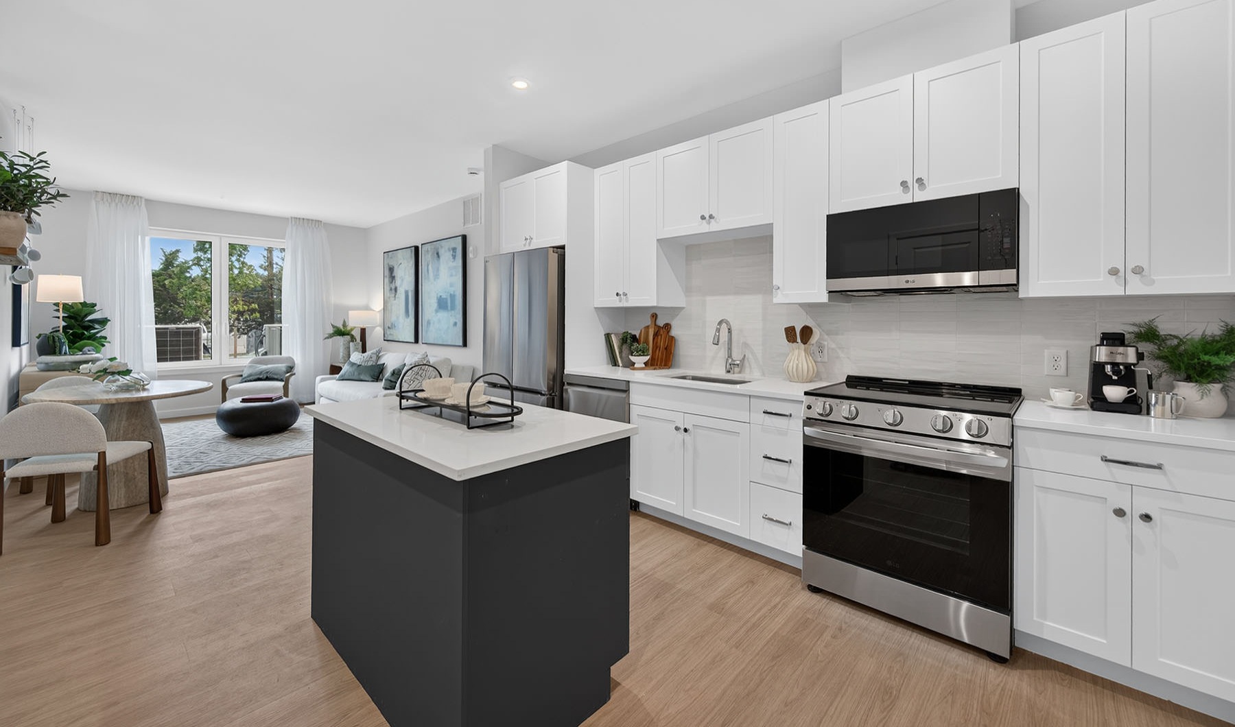 a kitchen with white cabinets