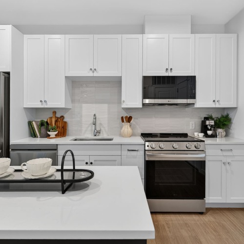 a kitchen with white cabinets