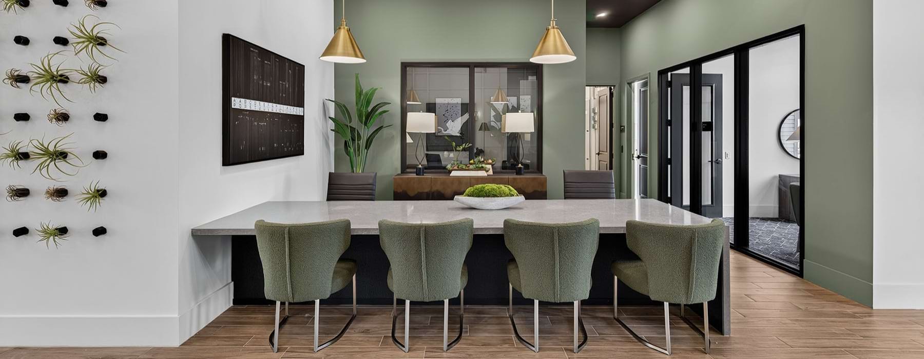 a clubroom with a table and chairs