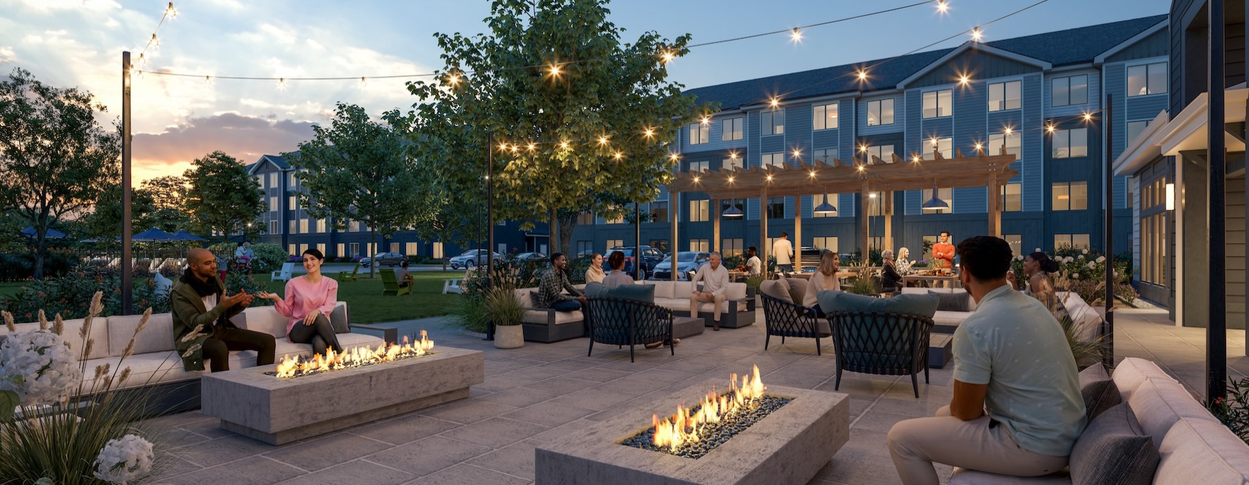 a courtyard with people, couches and fire pits