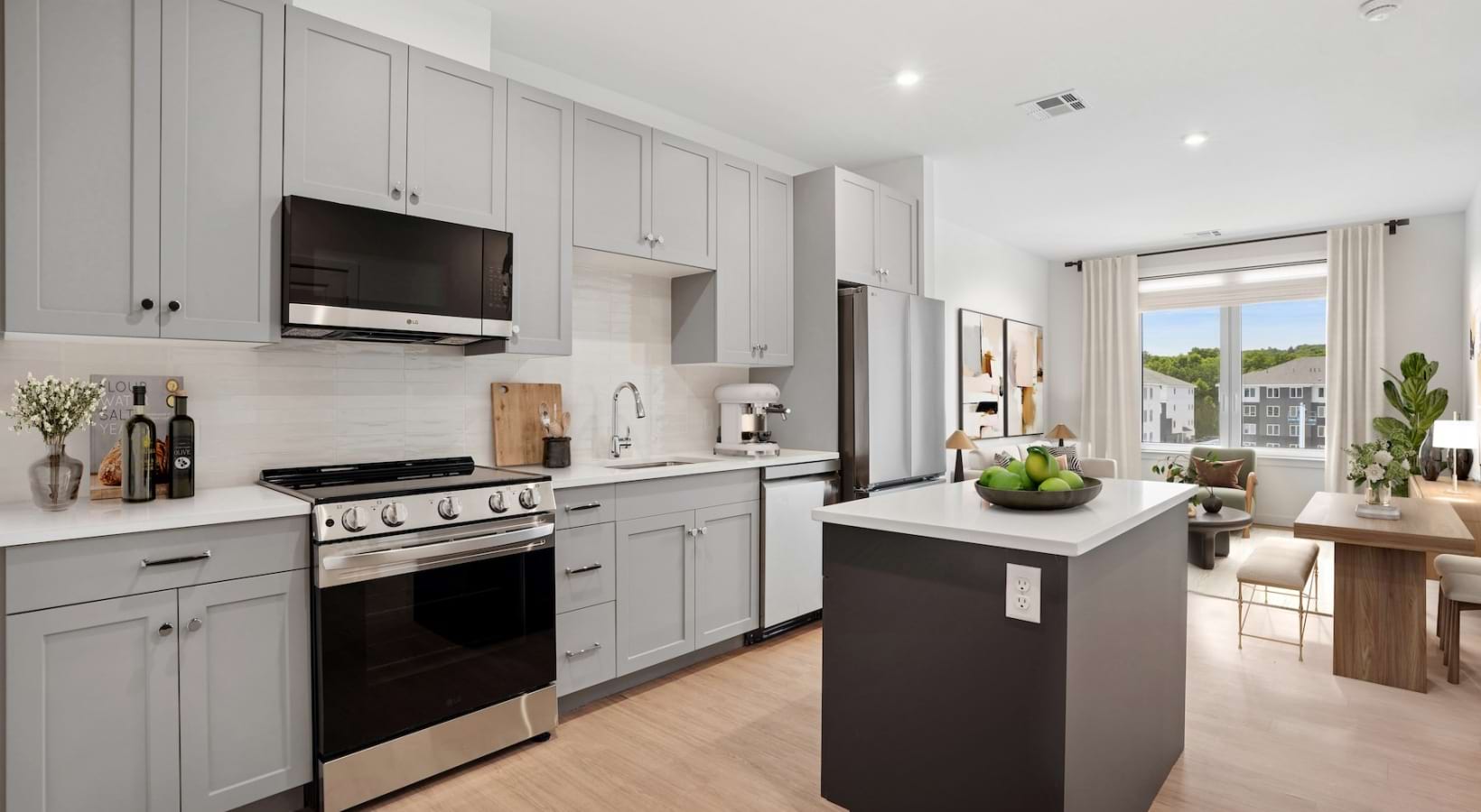 a kitchen with grey cabinets