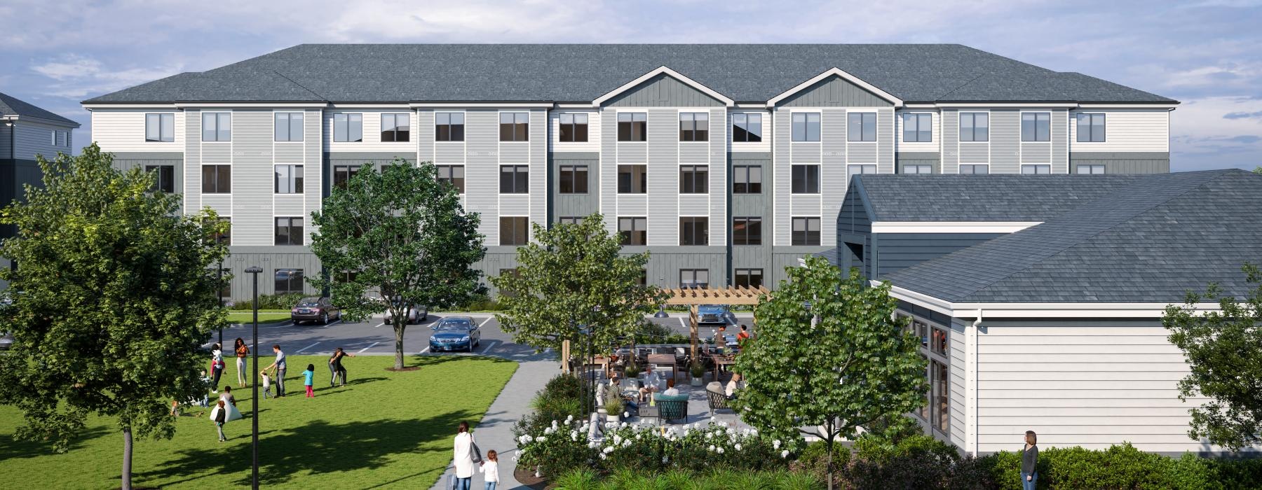 a large building with a lawn and trees in front of it